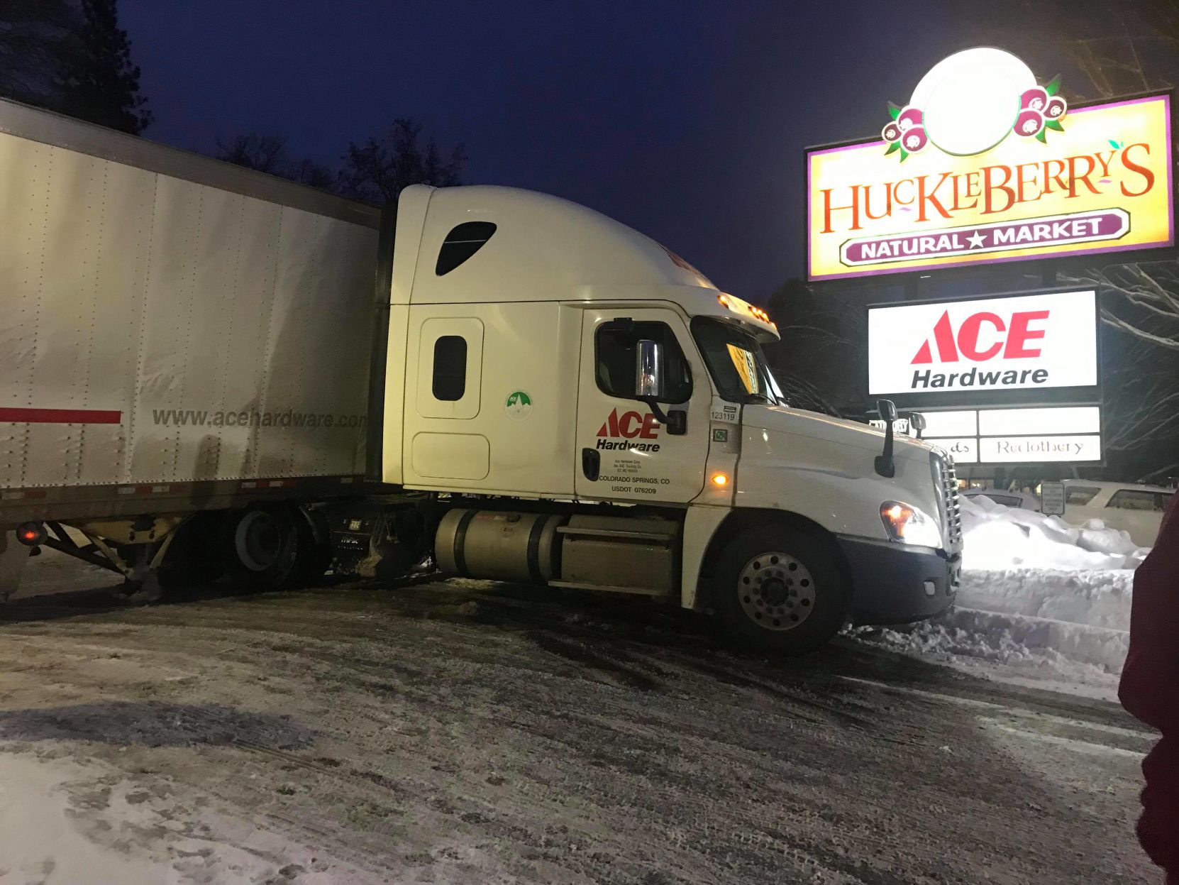 Semi jack-knifed at entrance to Huckleberry's parking lot